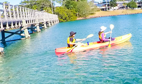 Go Sea Kayak paddlers exploring the river together